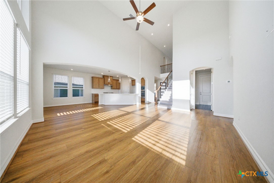 662 Hidden View Street New Braunfels, TX 78130 - Photo 12 of 46 a view of a livingroom with wooden floor and a window