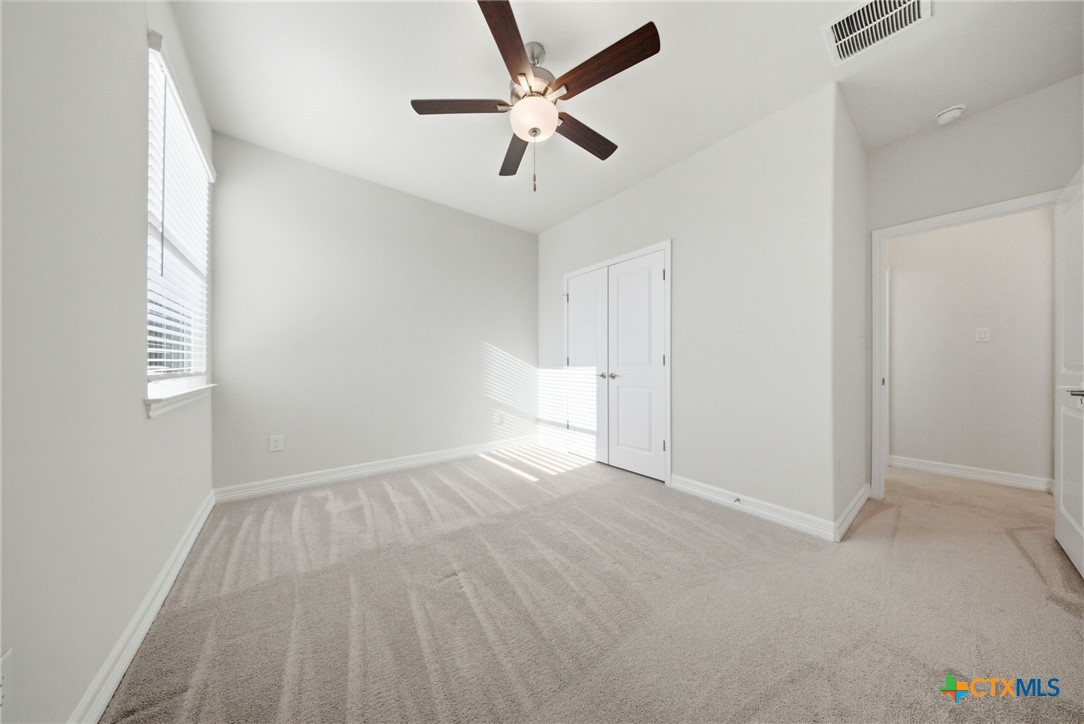 662 Hidden View Street New Braunfels, TX 78130 - Photo 34 of 46 wooden floor in an empty room with a window