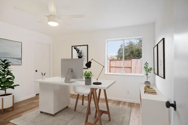 a workspace with furniture and window