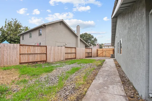 a view of a back yard of the house