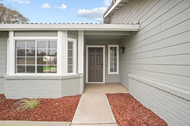 a view of a house with a large window