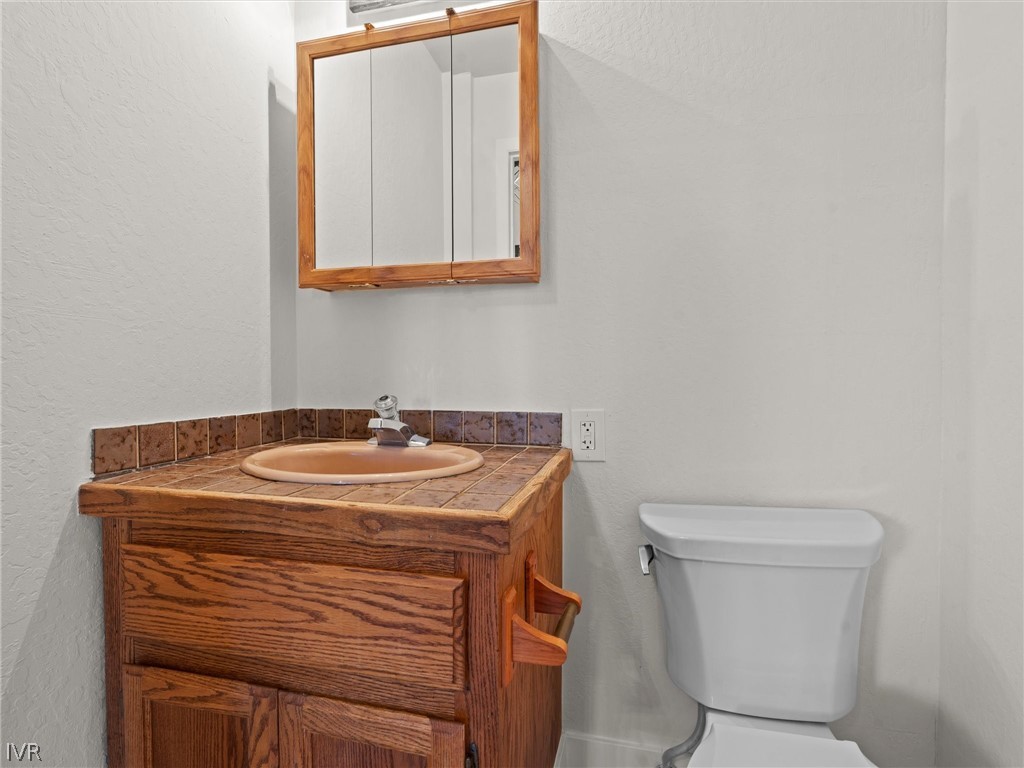 1106 Altdorf Terrace Incline Village, NV 89451 - Photo 22 of 50 a bathroom with a sink a toilet and mirror