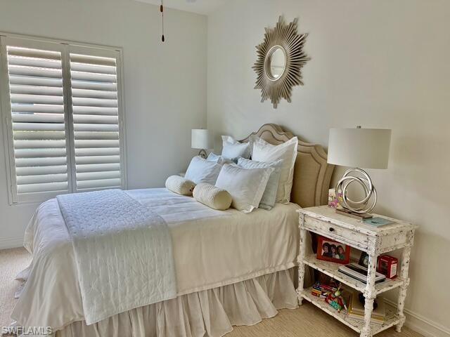 7476 Moorgate Point Way Naples, FL 34113 - Photo 11 of 20 a bedroom with a bed and window