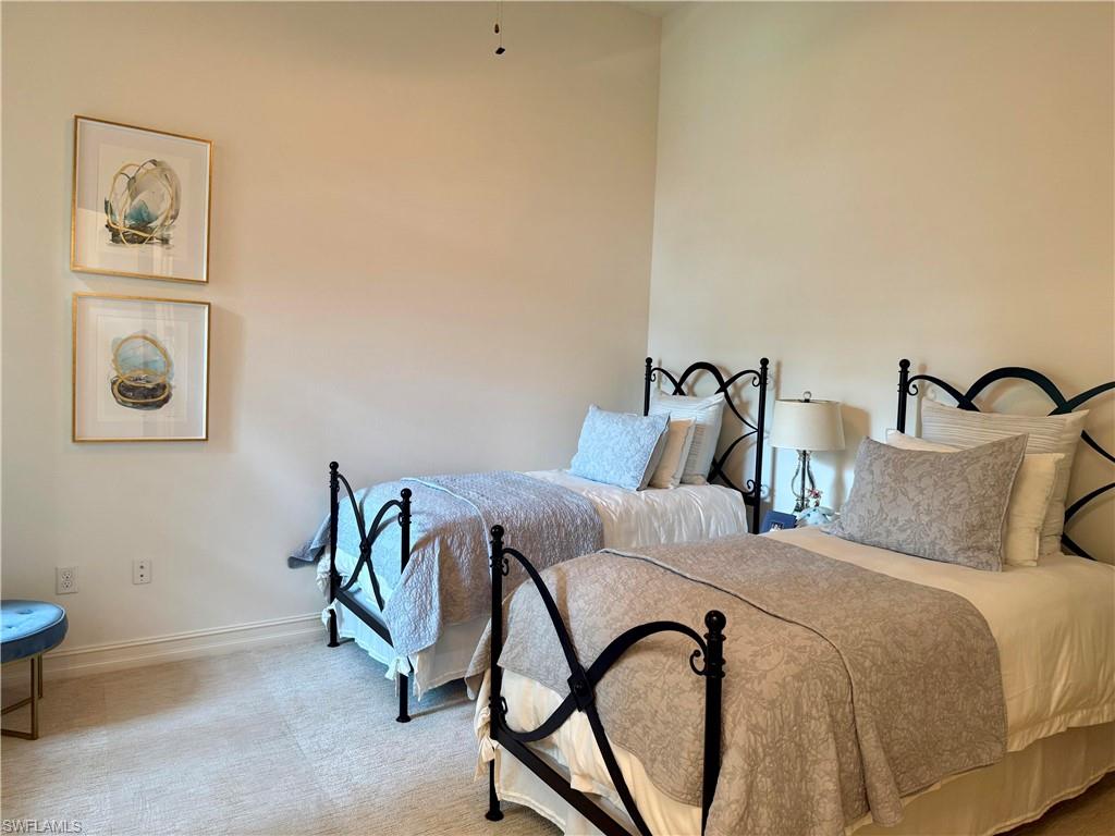 7476 Moorgate Point Way Naples, FL 34113 - Photo 13 of 20 a bedroom with a bed and the view of painting