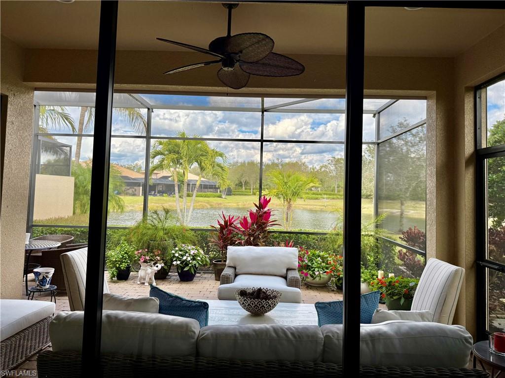7476 Moorgate Point Way Naples, FL 34113 - Photo 17 of 20 a living room with furniture and a potted plant