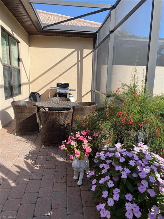 7476 Moorgate Point Way Naples, FL 34113 - Photo 19 of 20 a outdoor space with lots of flower plants