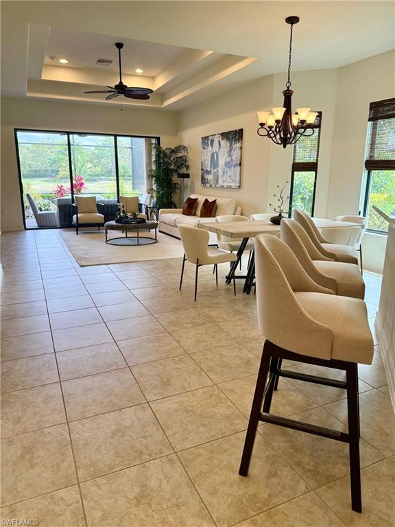 7476 Moorgate Point Way Naples, FL 34113 - Photo 3 of 20 a living room with furniture