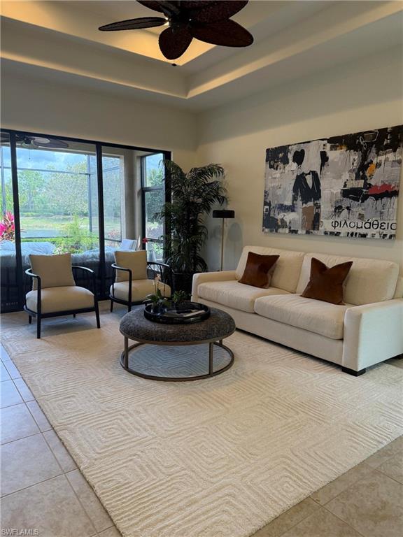 7476 Moorgate Point Way Naples, FL 34113 - Photo 4 of 20 a living room with furniture and a large window