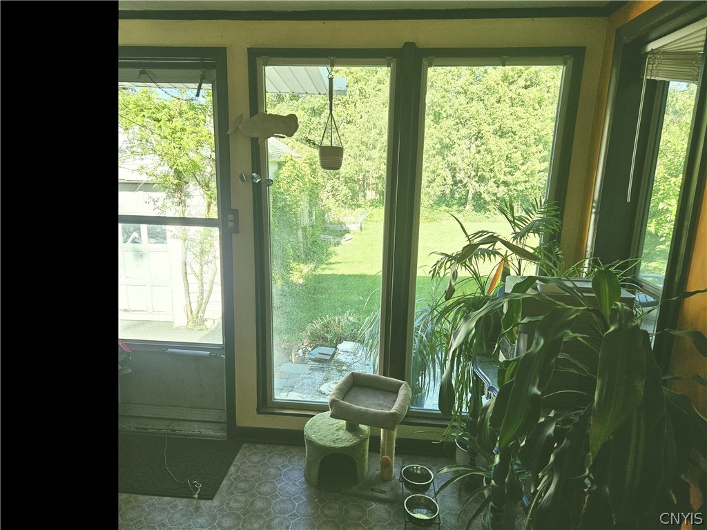 214 Revere Road DeWitt, NY 13214 - Photo 7 of 17 Convenient mud room off the kitchen and great light for plants!