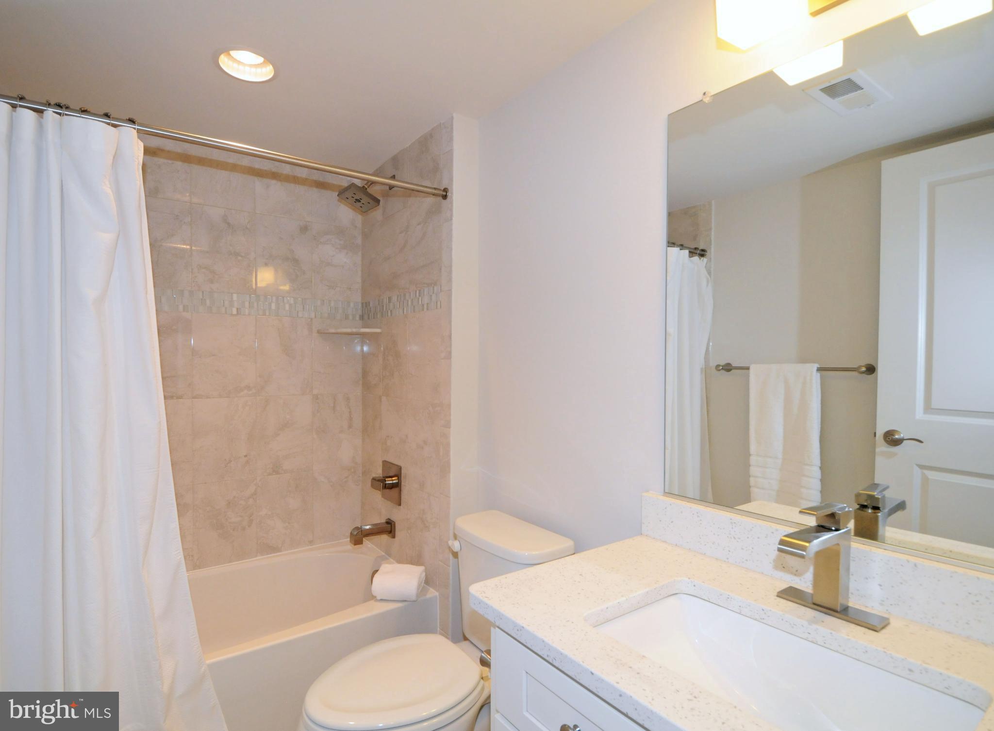2354 Chadlington Road Falls Church, VA 22043 - Photo 31 of 41 LOWER LEVEL FULL BATH WITH NEUTRAL TILE