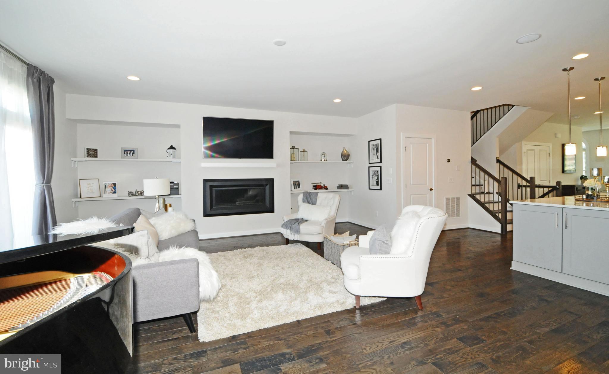 2354 Chadlington Road Falls Church, VA 22043 - Photo 6 of 41 LIVING RM/FAM RM & REC LIGHTS (SHELVES REMOVED)
