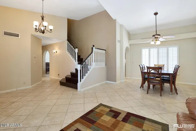 a view of entryway livingroom and hall with wooden floor