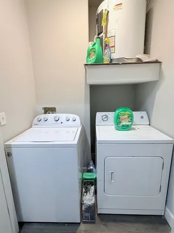 a bathroom with a sink toilet and a mirror