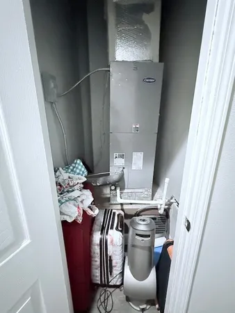 a bathroom with a granite countertop toilet sink and mirror