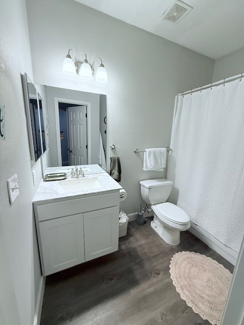 2410 South 2nd Street, Unit 625 Waco, TX 76706 - Photo 32 of 43 a bathroom with a sink a toilet and mirror