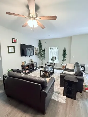 a kitchen with stainless steel appliances granite countertop a refrigerator a sink a stove and oven