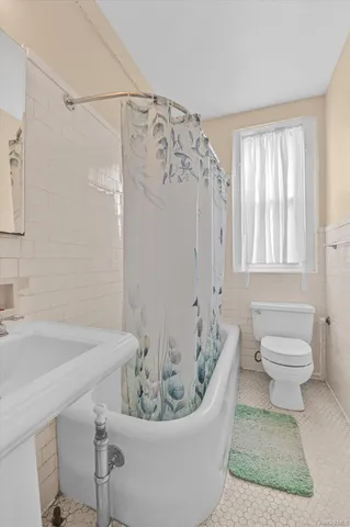 a bathroom with a bathtub and a sink