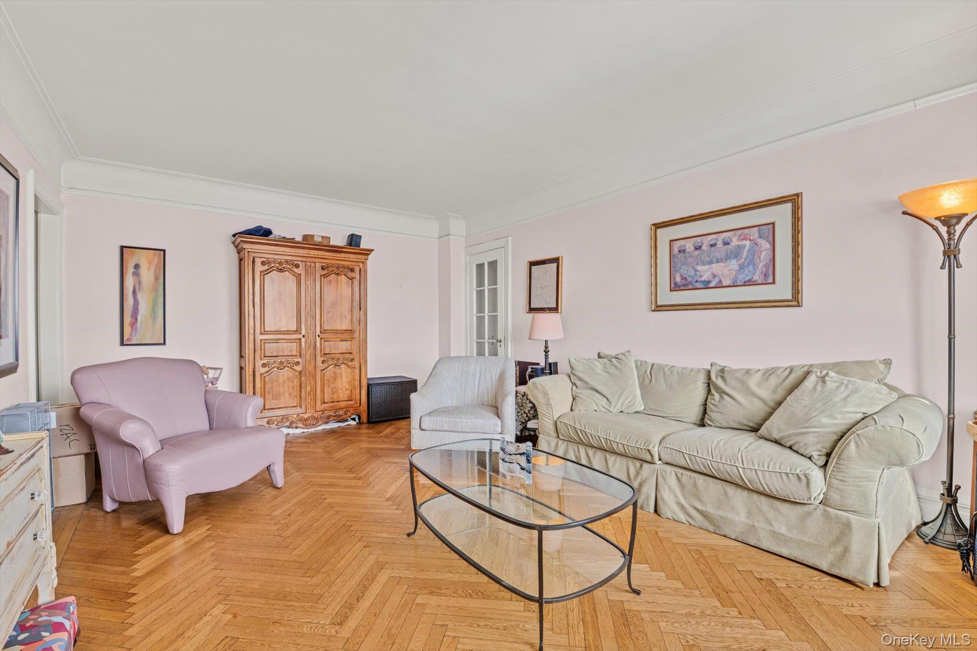 390 Riverside Drive, Unit 12AC Manhattan, NY 10025 - Photo 7 of 29 a living room with furniture and a window