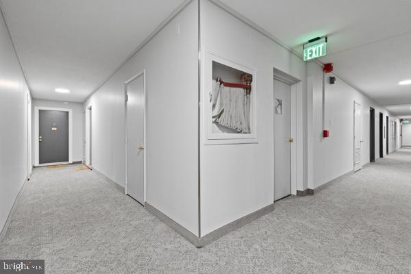 1101 St Paul Street, Unit 710 Baltimore, MD 21202 - Photo 15 of 21 a view of a hallway with closet area