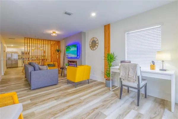 a bedroom with a bed and couch