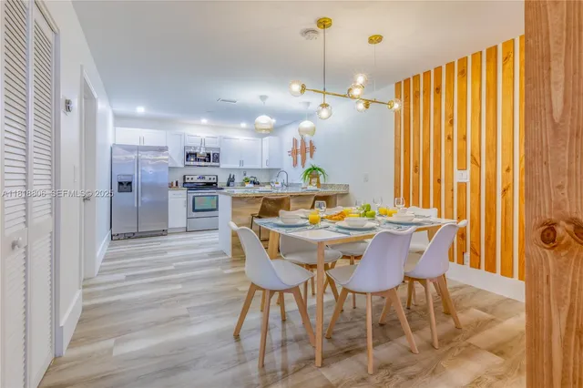 a kitchen with stainless steel appliances granite countertop a sink counter space and cabinets