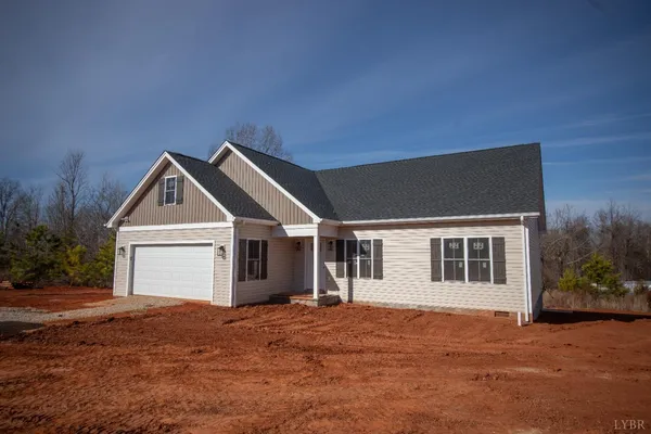 a front view of a house with yard