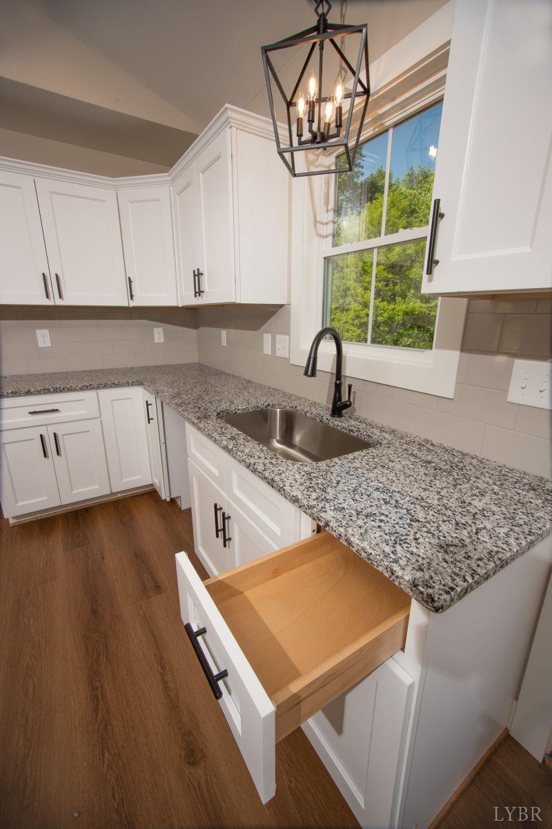 108 Montfair Drive Amherst, VA 24521 - Photo 11 of 39 a kitchen with sink cabinets and window