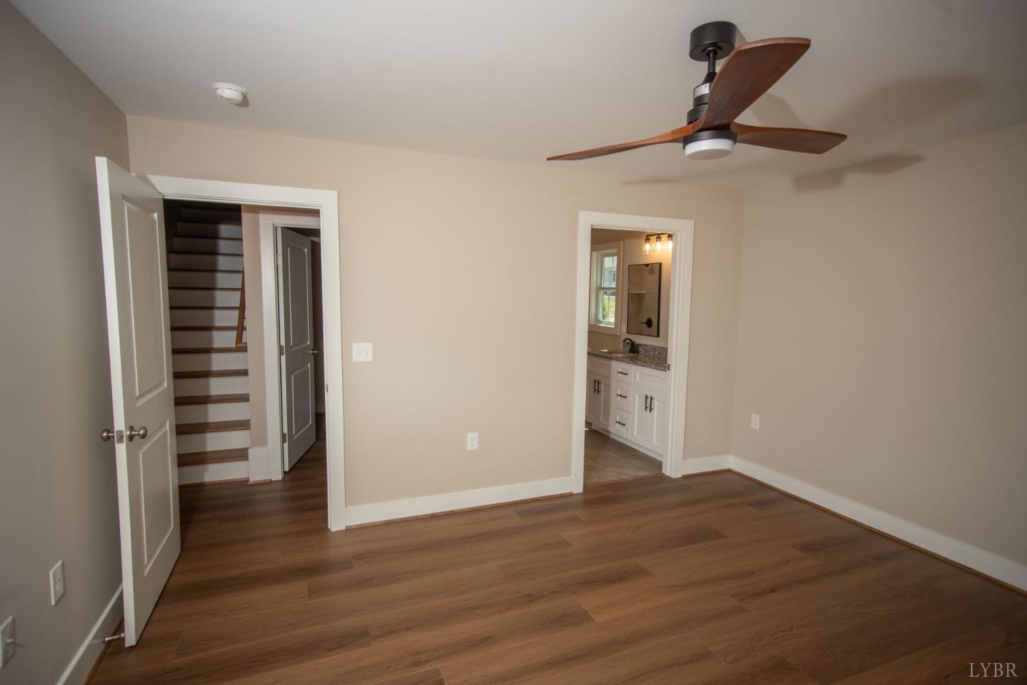 108 Montfair Drive Amherst, VA 24521 - Photo 13 of 39 wooden floor in an empty room with a window