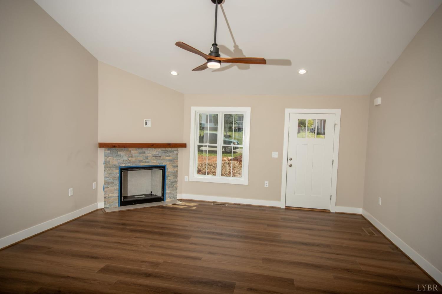 108 Montfair Drive Amherst, VA 24521 - Photo 3 of 39 a view of an empty room with wooden floor fireplace and a window