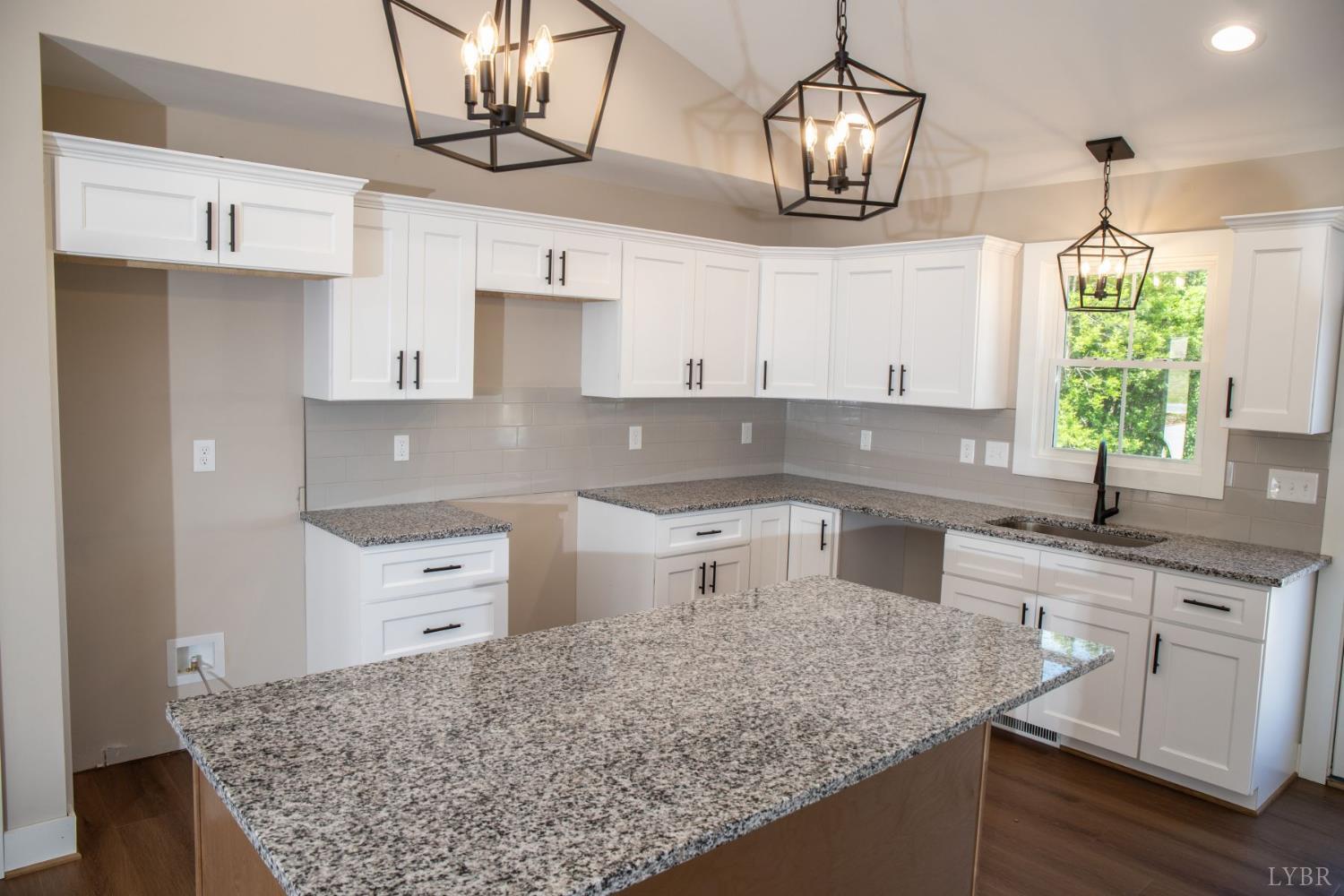 108 Montfair Drive Amherst, VA 24521 - Photo 6 of 39 a kitchen with stainless steel appliances granite countertop a sink a stove and cabinets