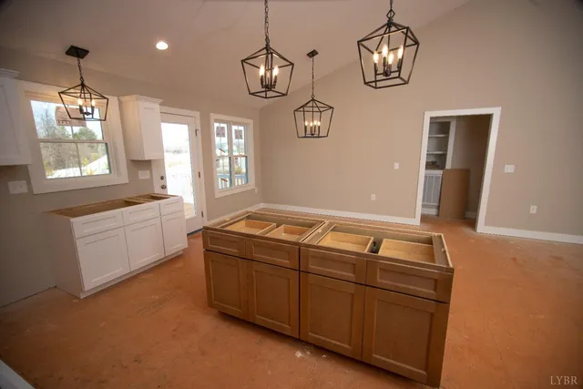 a living room with hard wood flooring and white walls
