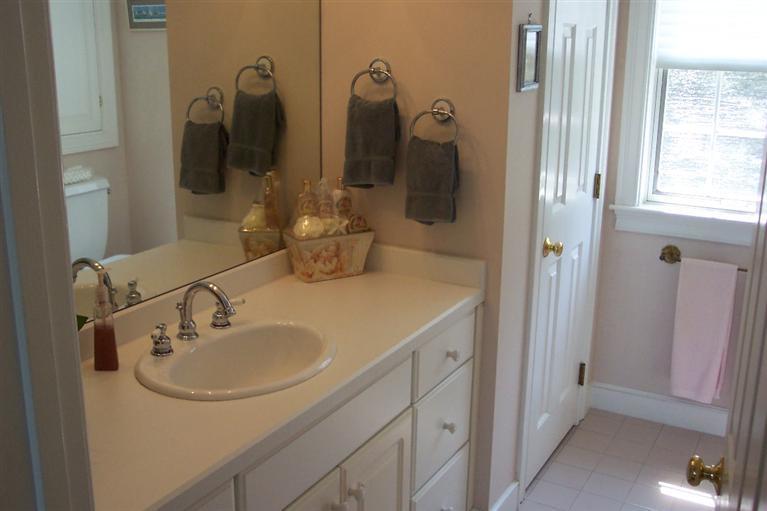 45 Bumps River Road Osterville, MA 02655 - Photo 17 of 21 a bathroom with a sink and mirror