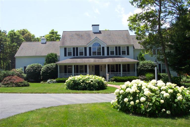 45 Bumps River Road Osterville, MA 02655 - Photo 21 of 21 a front view of a house with garden