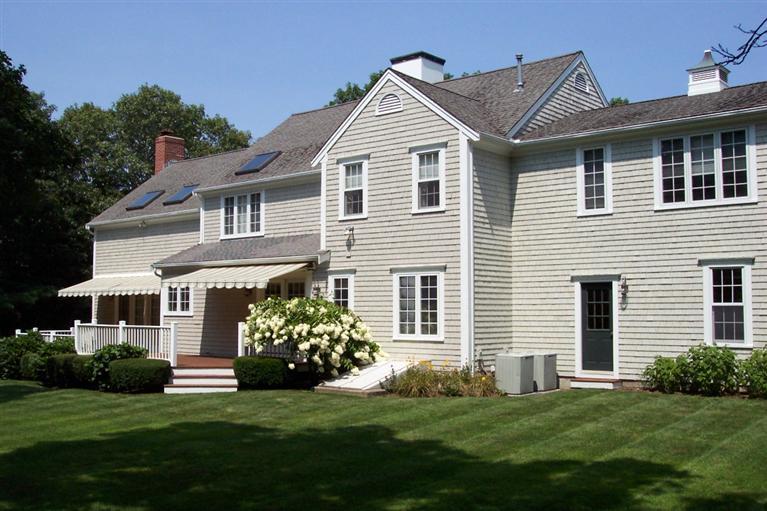 45 Bumps River Road Osterville, MA 02655 - Photo 3 of 21 a front view of a house with a garden
