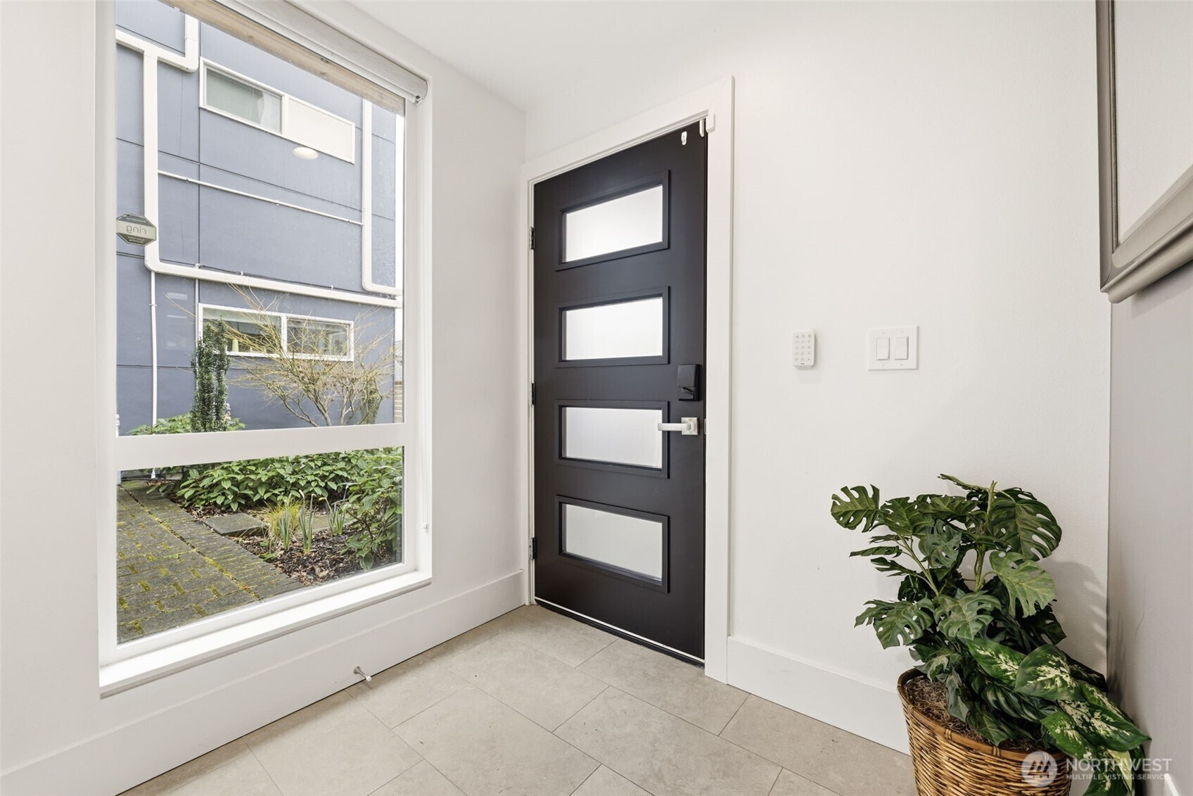 1926 Ferry Avenue Southwest Seattle, WA 98116 - Photo 26 of 40 a view of an entryway with a flower pot