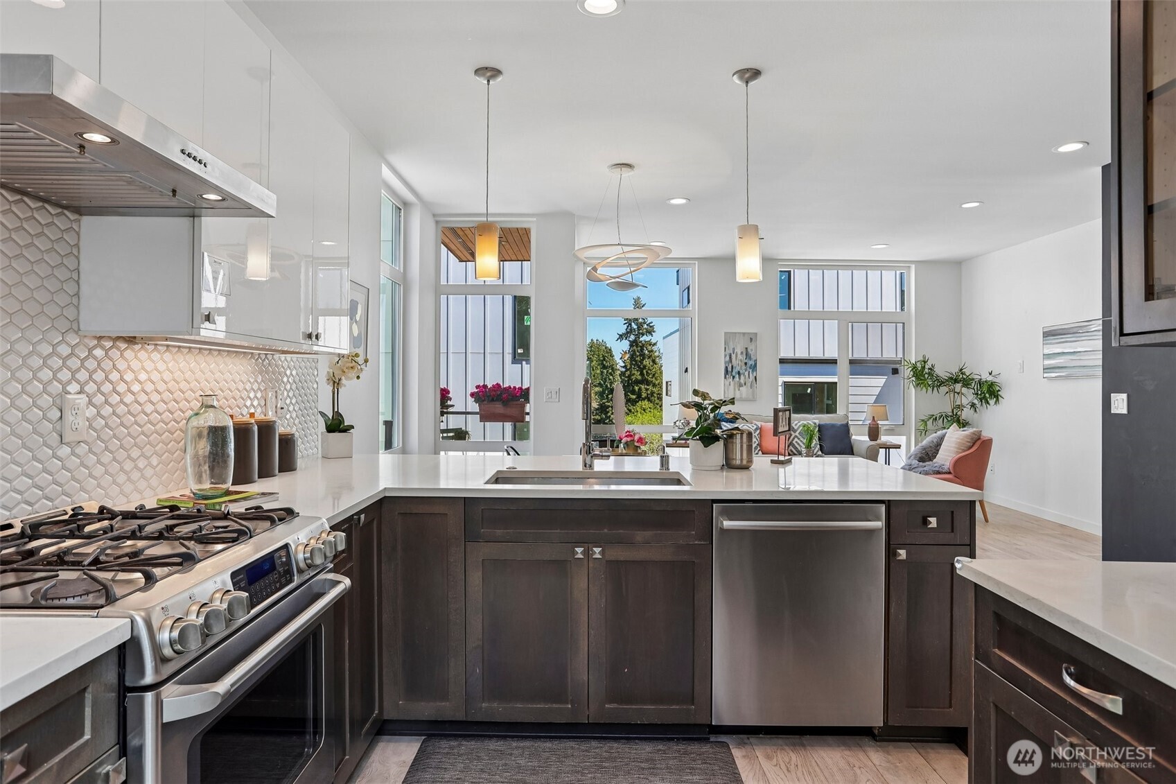 1926 Ferry Avenue Southwest Seattle, WA 98116 - Photo 5 of 40 a kitchen with stainless steel appliances a sink a stove and a wooden floors