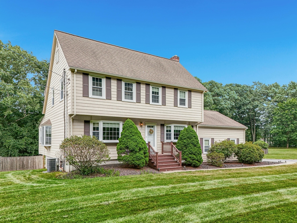 36 Turner Street Norfolk, MA 02056 - Photo 1 of 41 a front view of a house with a yard