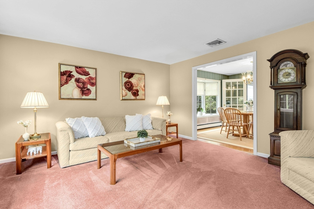 36 Turner Street Norfolk, MA 02056 - Photo 14 of 41 a living room with furniture and a flat screen tv