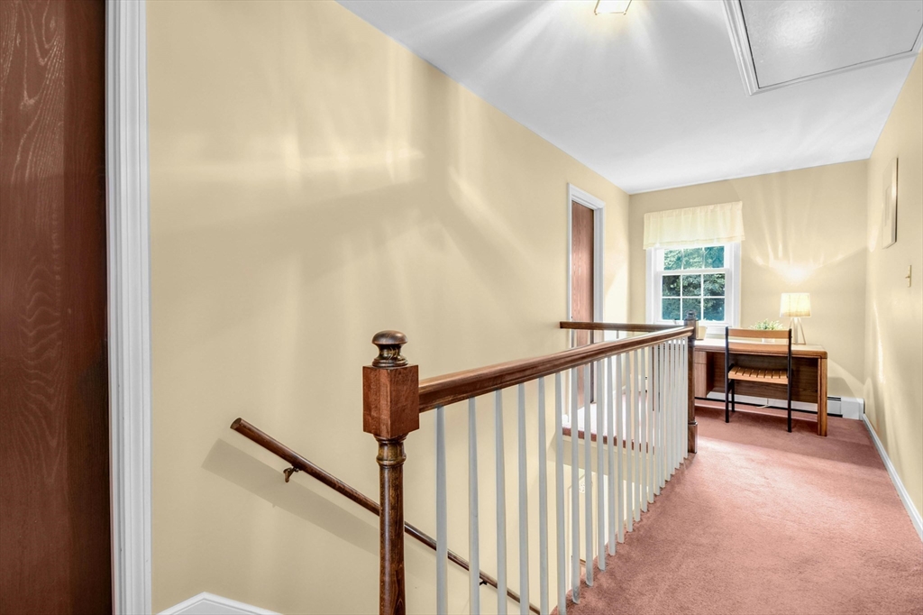 36 Turner Street Norfolk, MA 02056 - Photo 16 of 41 a view of a hallway with windows and stairs