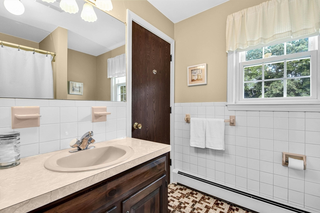 36 Turner Street Norfolk, MA 02056 - Photo 19 of 41 a bathroom with a sink and a mirror