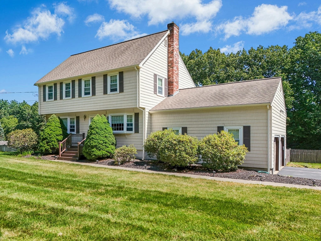 36 Turner Street Norfolk, MA 02056 - Photo 2 of 41 a front view of a house with a yard