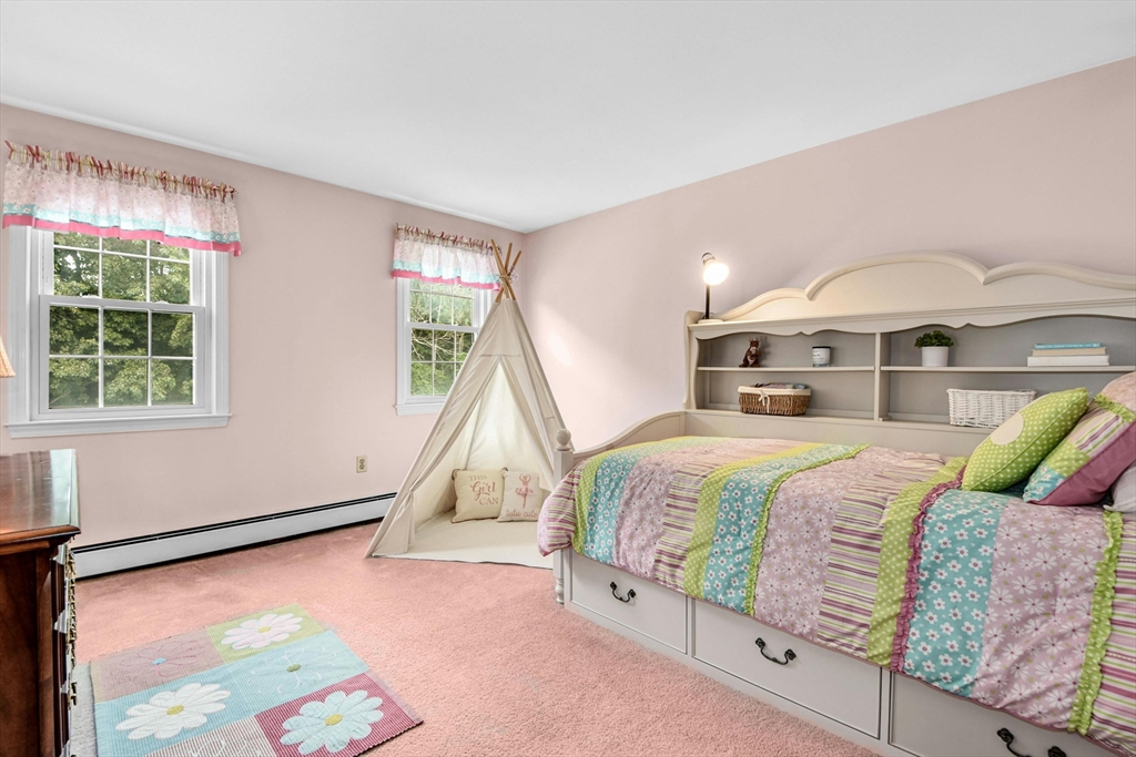 36 Turner Street Norfolk, MA 02056 - Photo 21 of 41 a bed sitting in a bedroom next to a window