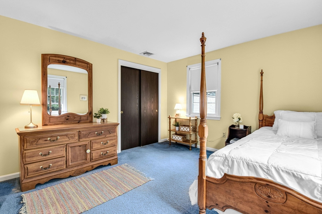 36 Turner Street Norfolk, MA 02056 - Photo 22 of 41 a bedroom with a bed and large mirror