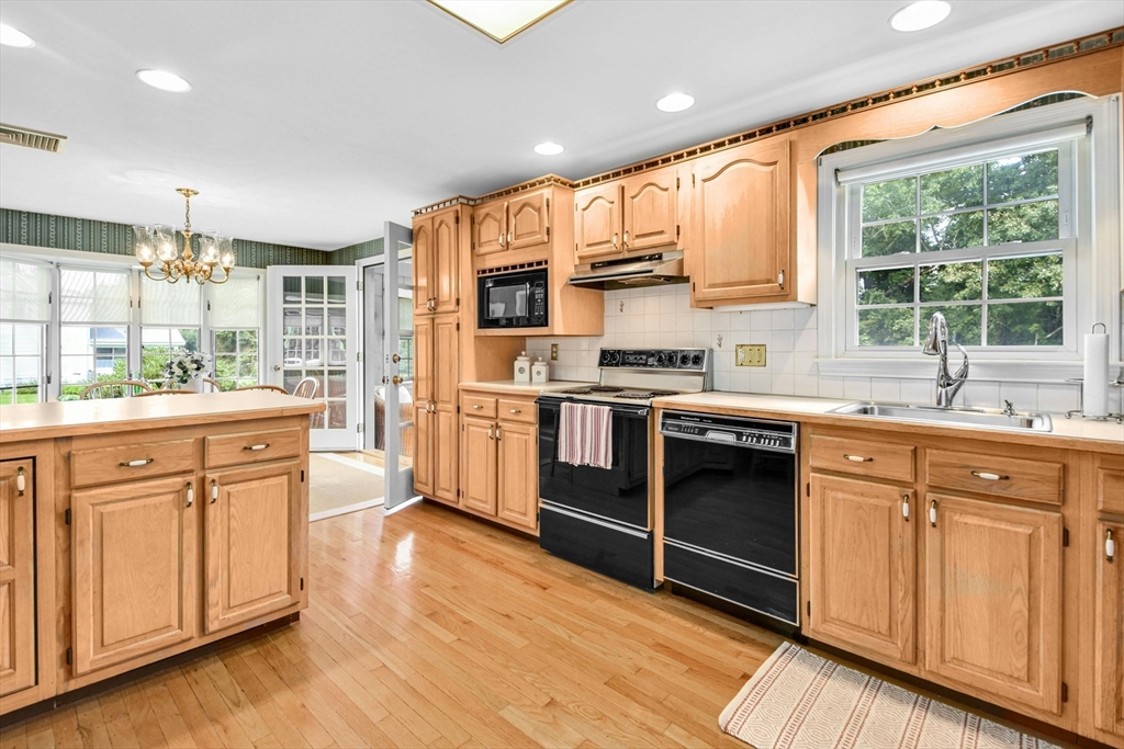 36 Turner Street Norfolk, MA 02056 - Photo 3 of 41 a kitchen with stainless steel appliances a stove sink and cabinets