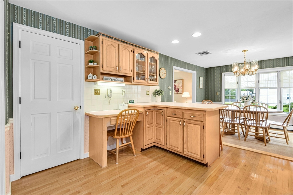 36 Turner Street Norfolk, MA 02056 - Photo 4 of 41 a kitchen with stainless steel appliances granite countertop a white cabinets and wooden floors