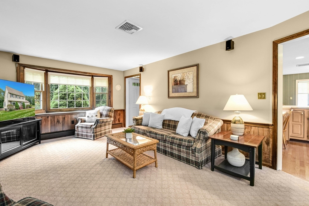 36 Turner Street Norfolk, MA 02056 - Photo 10 of 41 a living room with furniture and a flat screen tv