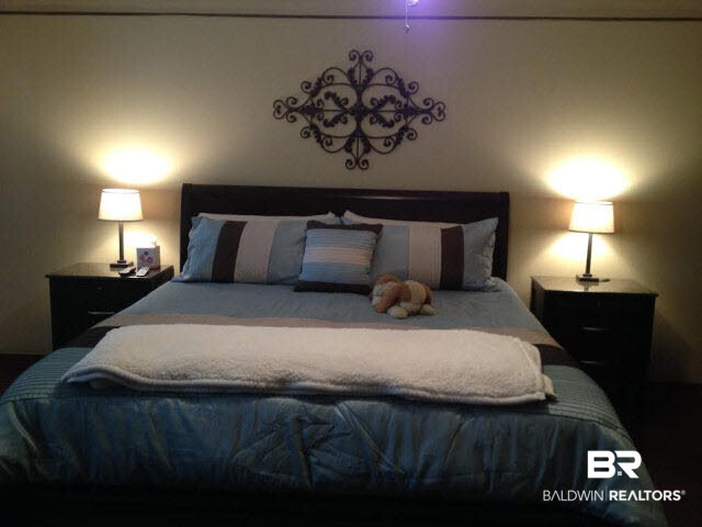 111 Woodside Drive Daphne, AL 36526 - Photo 11 of 31 Master bedroom is downstairs just off the hallway