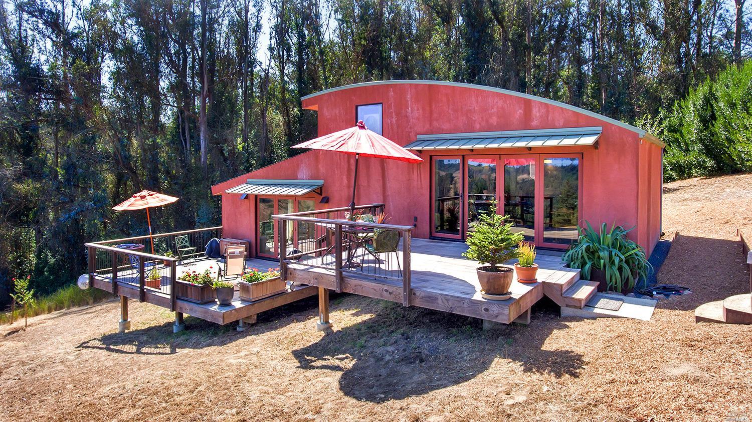 9820 Barnett Valley Road Sebastopol, CA 95472 - Photo 1 of 1 a view of a house with backyard porch and sitting area