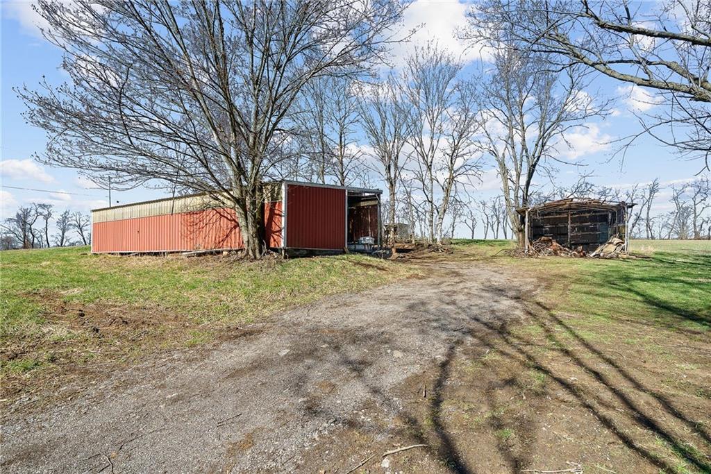 587 Brownsdale Road Renfrew, PA 16053 - Photo 3 of 36 Large pole building and ample parking, providing space for vehicles, equipment, or workshop needs
