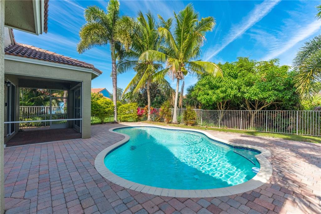 a view of a swimming pool with a patio